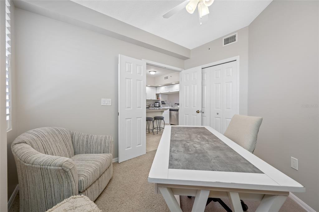 960 Starkey Road, Unit 5504 Largo, FL 33771 - Photo 16 of 46 a living room with furniture and a chandelier