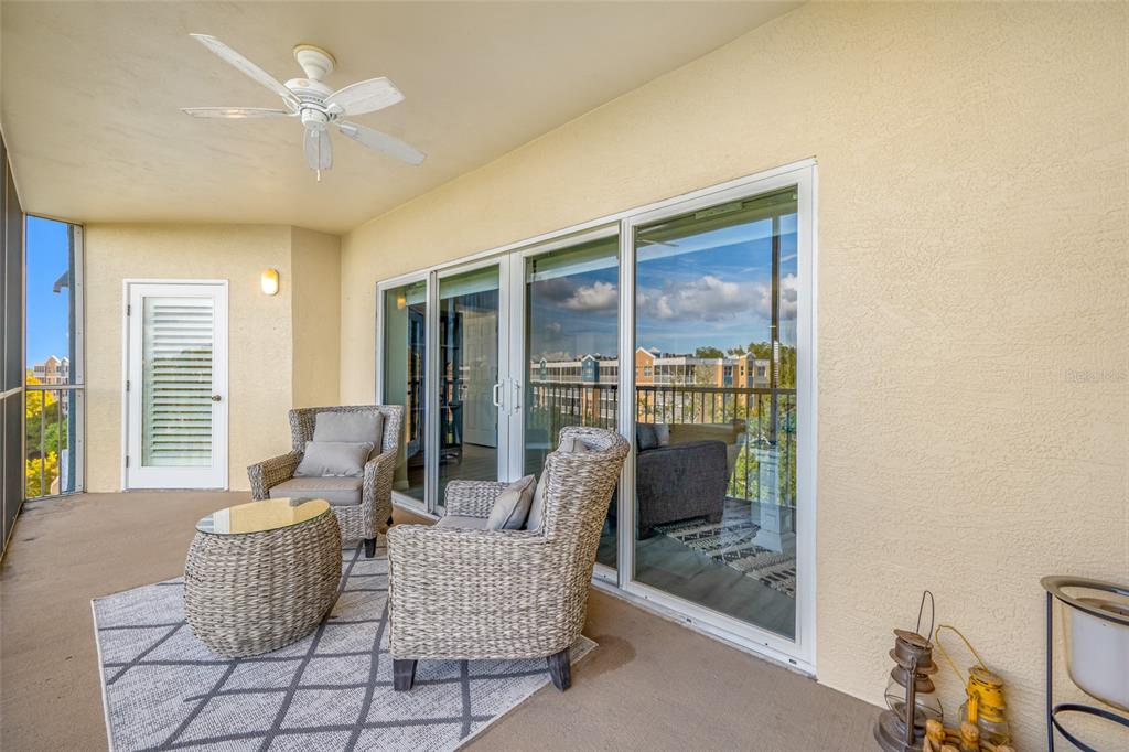 960 Starkey Road, Unit 5504 Largo, FL 33771 - Photo 19 of 46 a living room with furniture and a floor to ceiling window