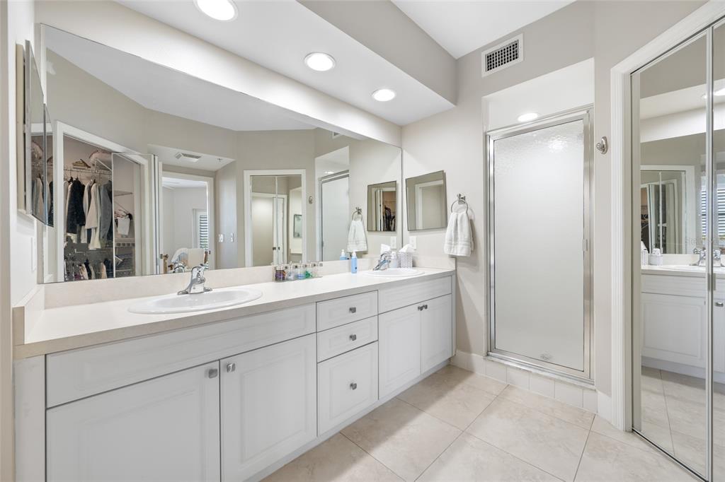 960 Starkey Road, Unit 5504 Largo, FL 33771 - Photo 25 of 46 a bathroom with double sink and a mirror