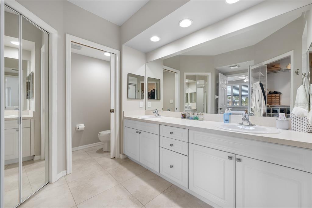 960 Starkey Road, Unit 5504 Largo, FL 33771 - Photo 28 of 46 a spacious bathroom with a granite countertop sink mirror and toilet