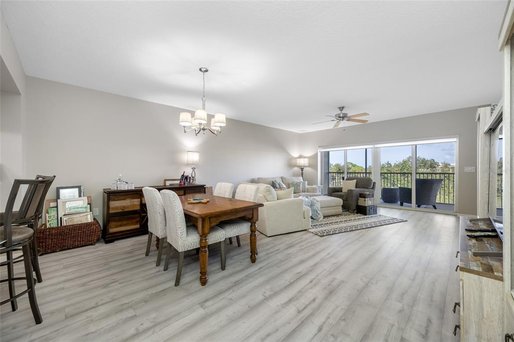 960 Starkey Road, Unit 5504 Largo, FL 33771 - Photo 29 of 46 a view of a dining room with furniture window and wooden floor