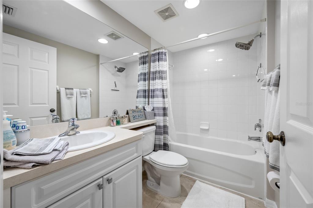 960 Starkey Road, Unit 5504 Largo, FL 33771 - Photo 34 of 46 a bathroom with a sink a toilet and shower