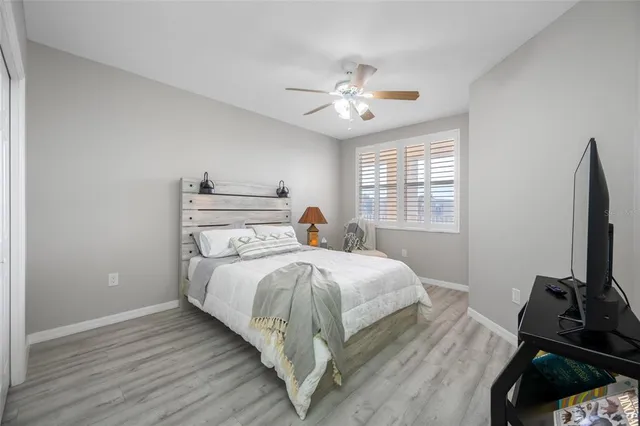 a bed room with a bed and a window