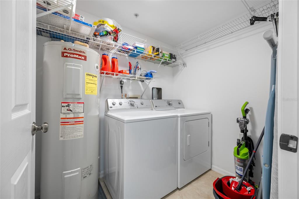 960 Starkey Road, Unit 5504 Largo, FL 33771 - Photo 38 of 46 a utility room with sink dryer and washer
