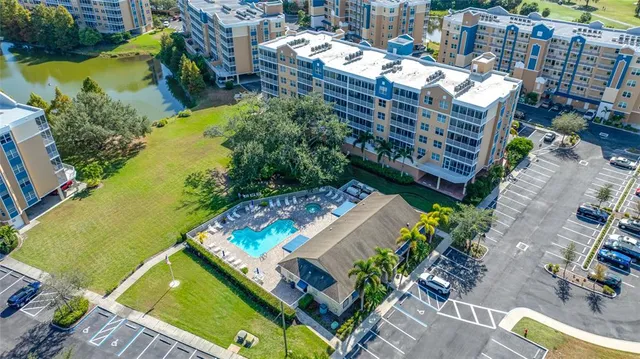 an aerial view of a residential apartment building with a yard
