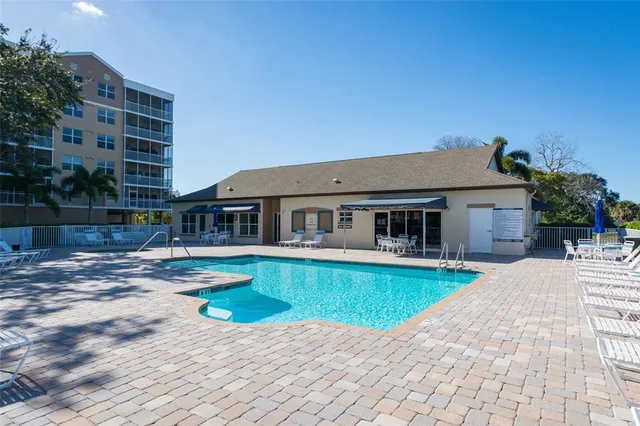 a view of house with swimming pool yard