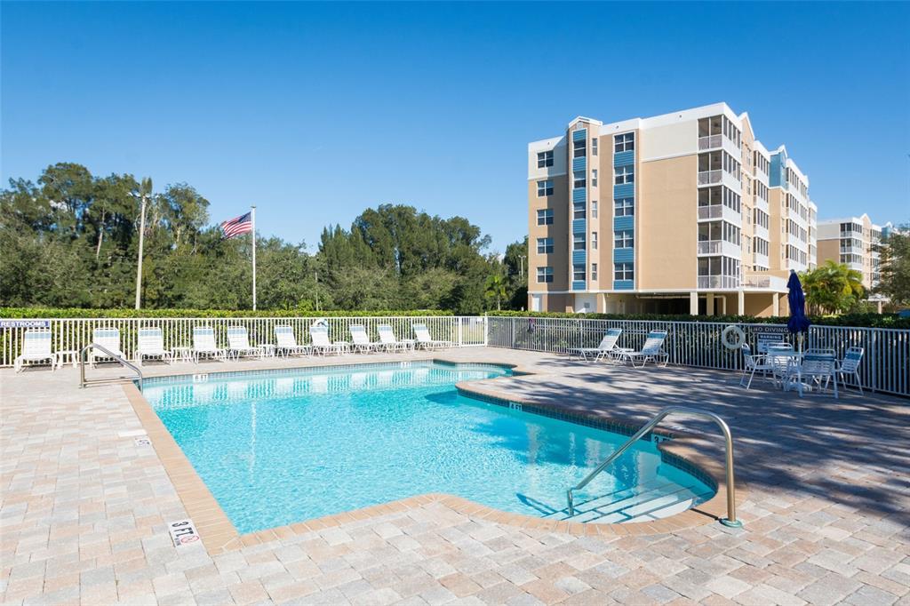 960 Starkey Road, Unit 5504 Largo, FL 33771 - Photo 5 of 46 a view of a swimming pool with a patio