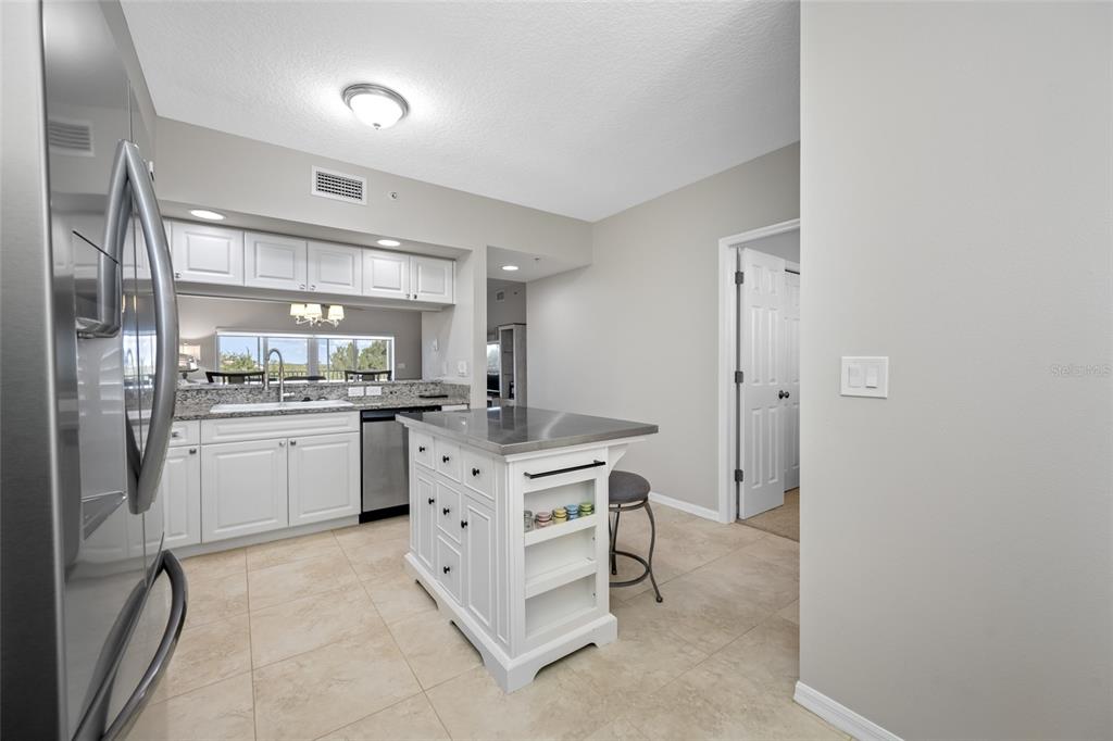 960 Starkey Road, Unit 5504 Largo, FL 33771 - Photo 10 of 46 a kitchen with a sink and refrigerator