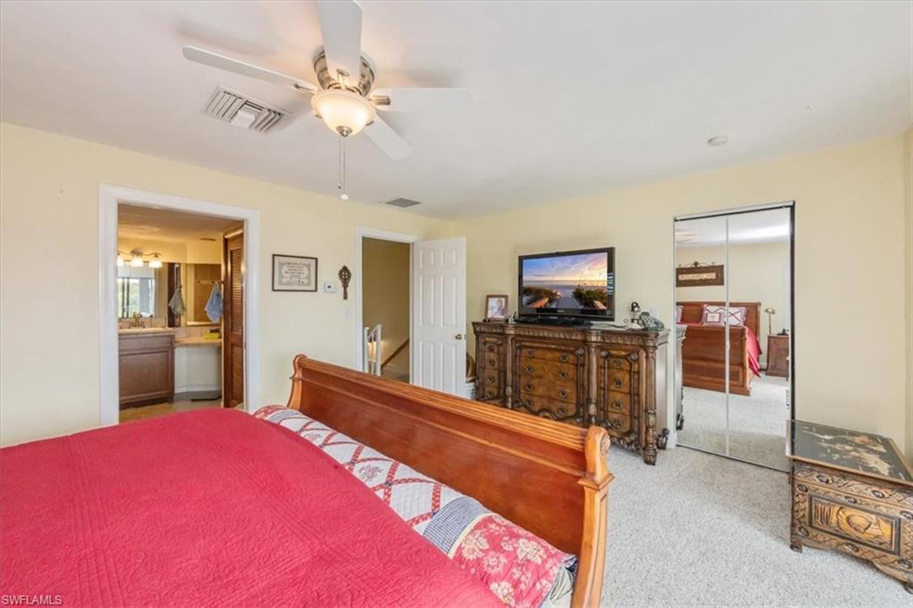 1400 Blue Point Avenue, Unit 208 Naples, FL 34102 - Photo 12 of 24 a bed room with a bed and a television