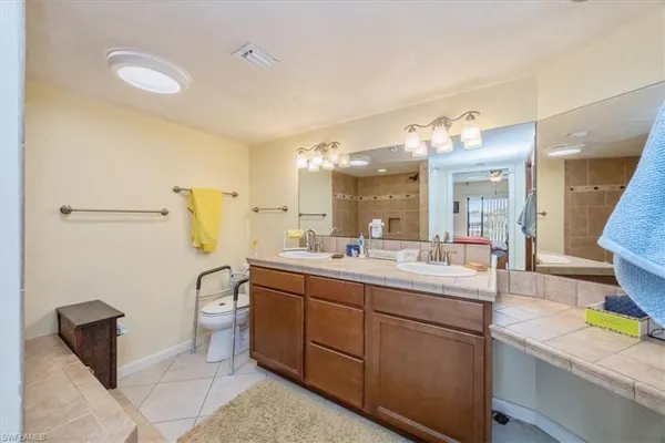 a kitchen with a sink appliances and cabinets