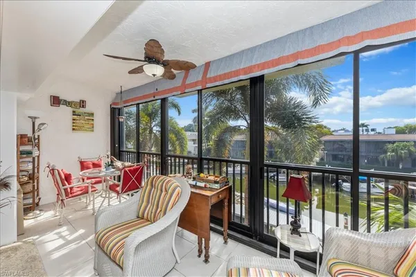 a view of a living room and balcony