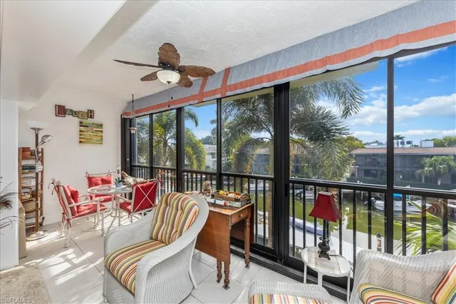 a view of a living room and balcony