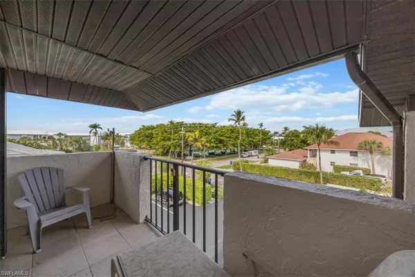 a view of balcony with furniture