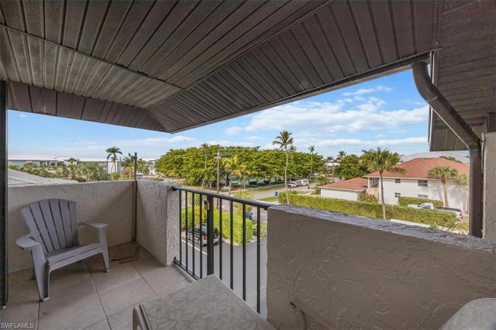 1400 Blue Point Avenue, Unit 208 Naples, FL 34102 - Photo 22 of 24 a view of balcony with furniture