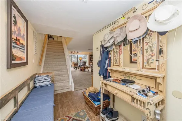 a view of an entryway with wooden floor