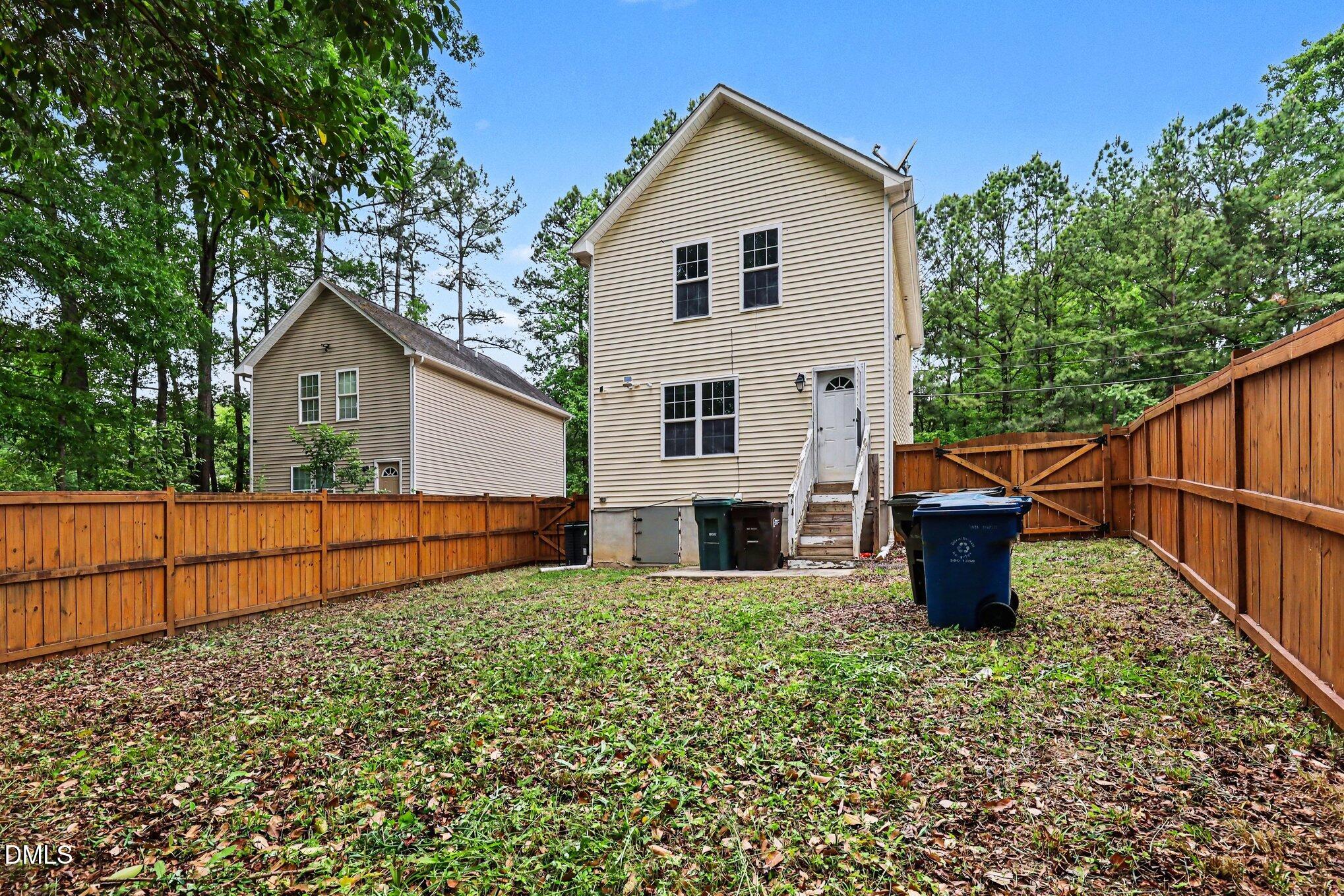 704 Brye Street Durham, NC 27703 - Photo 29 of 34 a view of a house with backyard and sitting area
