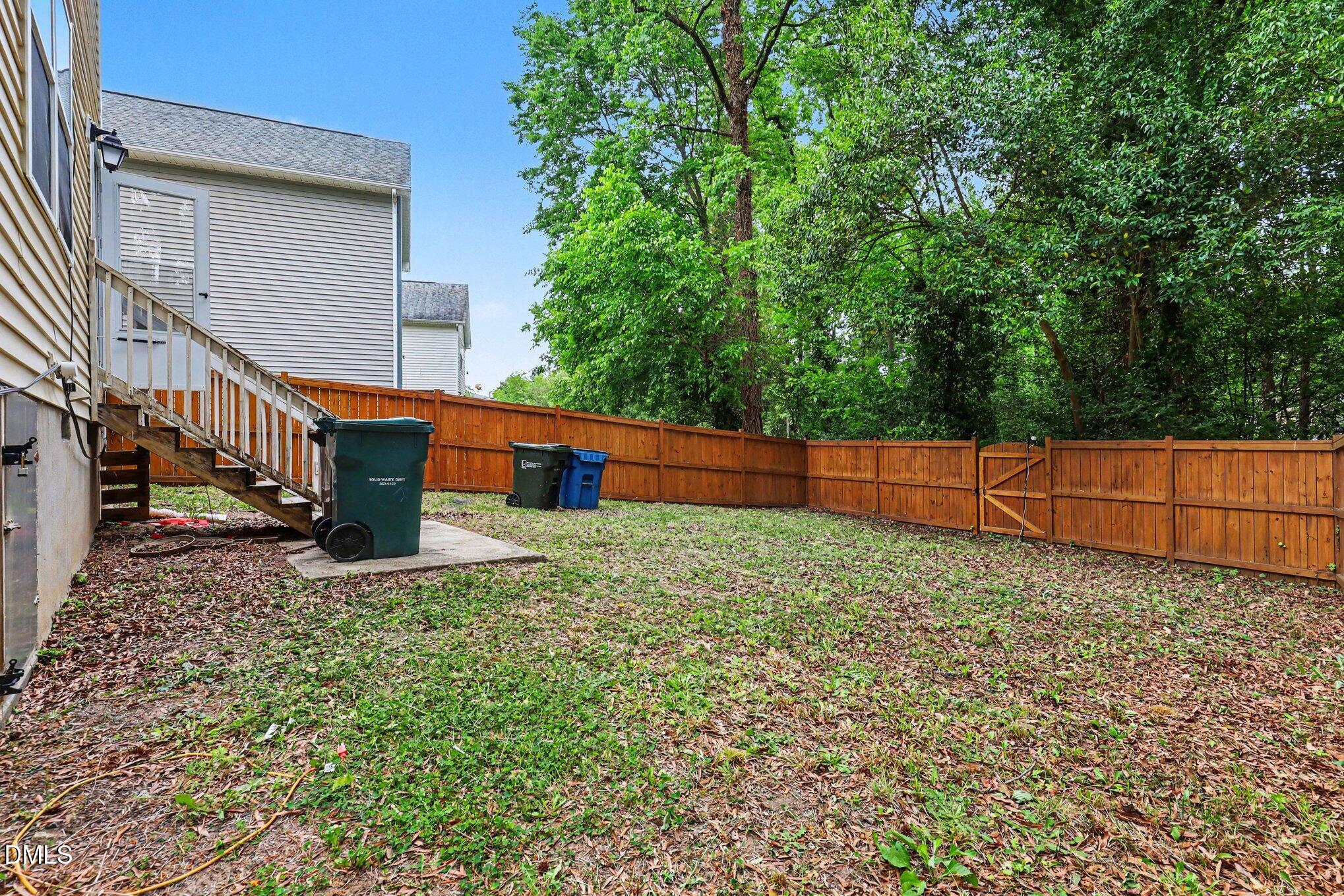 704 Brye Street Durham, NC 27703 - Photo 32 of 34 a backyard of a house with lots of green space