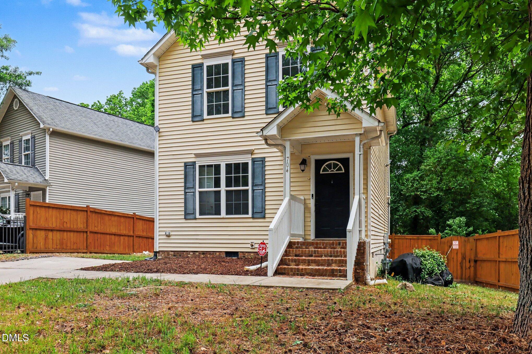704 Brye Street Durham, NC 27703 - Photo 3 of 34 a front view of a house with a yard