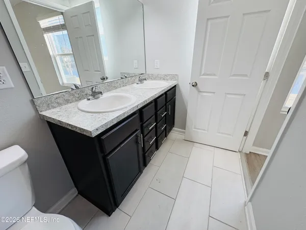a bathroom with a sink and a toilet