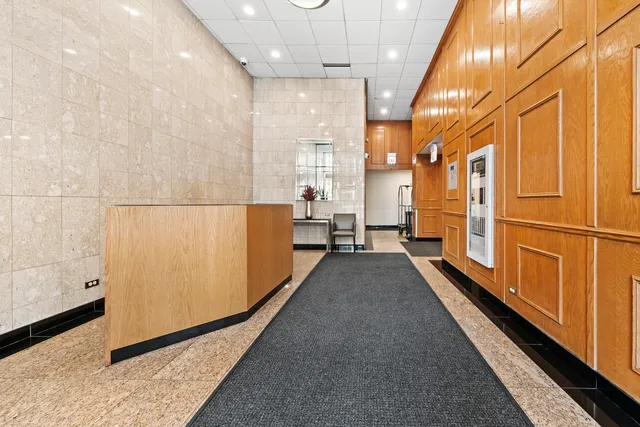 a view of a large hall with wooden floor