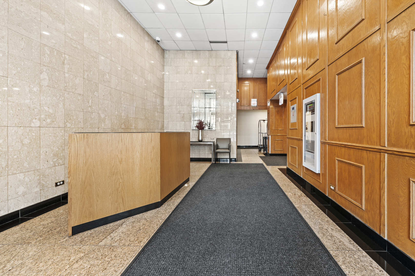 1540 North LaSalle Street, Unit 907 Chicago, IL 60610 - Photo 14 of 16 a view of a large hall with wooden floor