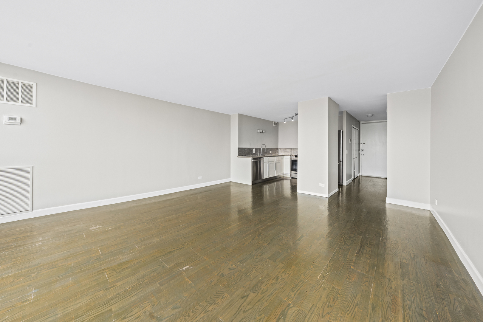 1540 North LaSalle Street, Unit 907 Chicago, IL 60610 - Photo 5 of 16 a view of empty room with wooden floor
