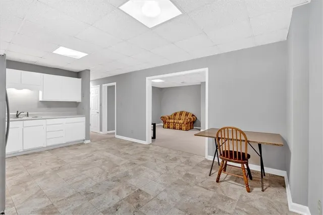 a view of a livingroom with furniture and a window