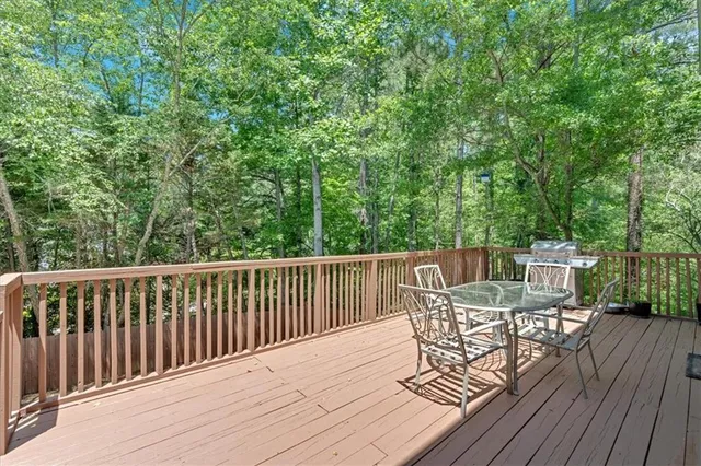 a view of a deck with furniture and wooden floor