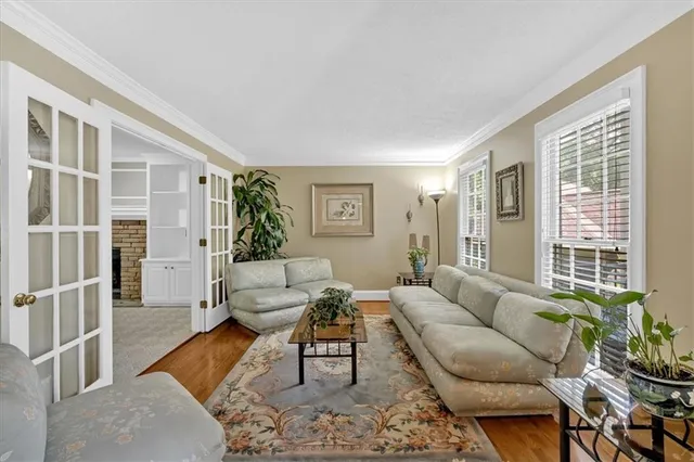 a living room with furniture and windows