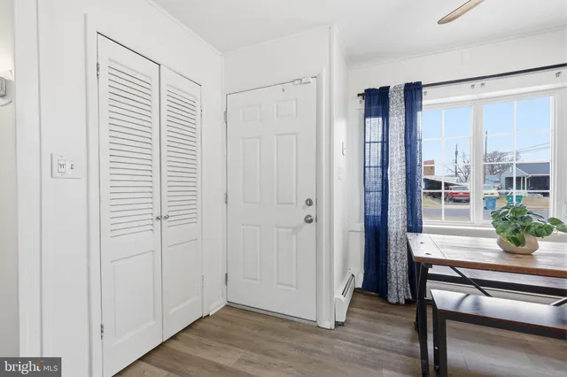 a view of a patio with table and chairs