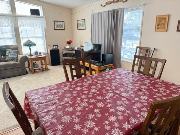 a bed room with a bed and a chair