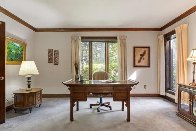 a workspace with furniture and a window