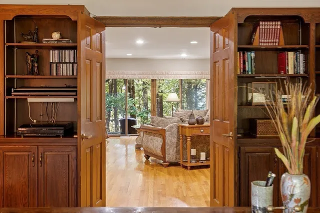 a living room with fireplace furniture and a flat screen tv