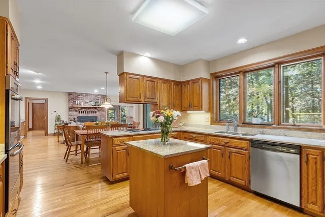 a kitchen with lots of counter top space and dining table