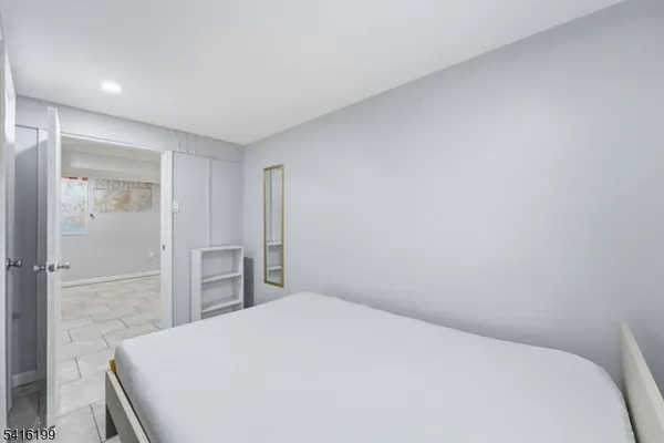 a bedroom with a bed and closet