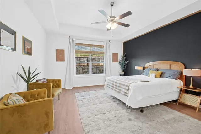 a dining room with furniture and wooden floor