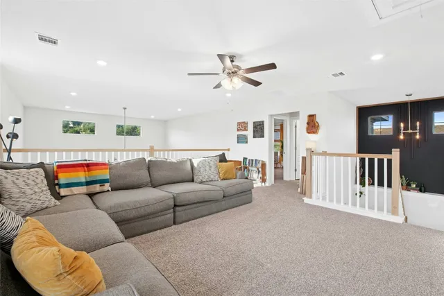 a bathroom with a toilet a sink and a mirror