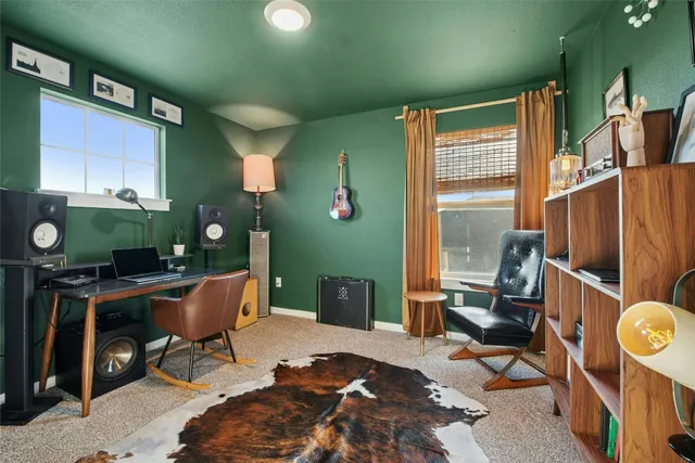 a workspace with furniture and a window