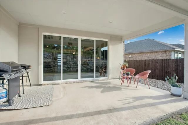 a outdoor space with a couch and chairs