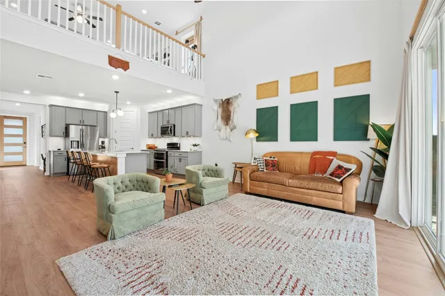 a bedroom with furniture and a large window