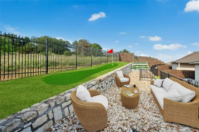 a view of a patio with couches chairs and a fire pit
