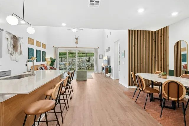 a bedroom with a bed and glass door