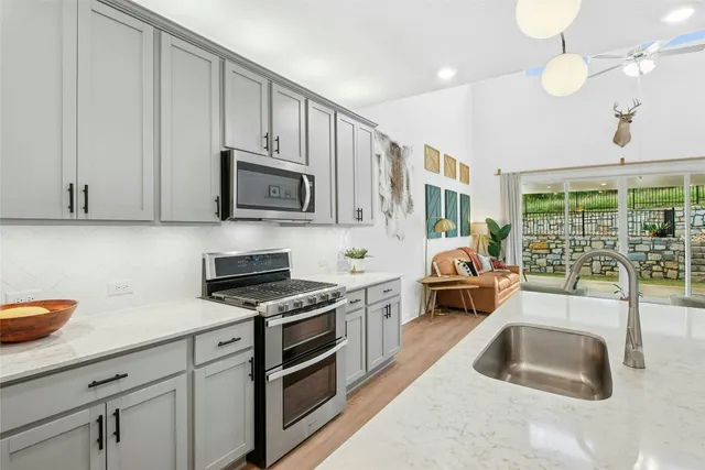 a dining room with furniture and wooden floor