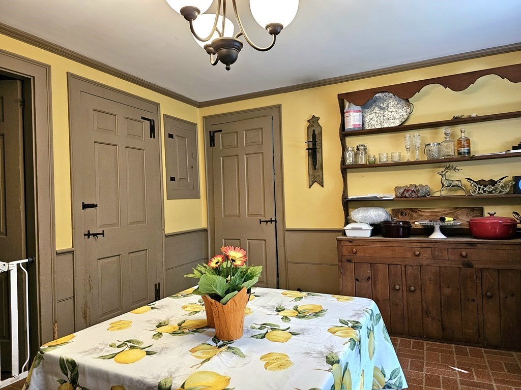 46 Willard Road Sturbridge, MA 01566 - Photo 15 of 37 a bedroom with a bed and a table in it