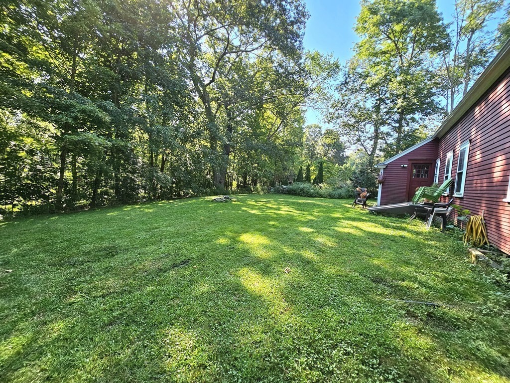 46 Willard Road Sturbridge, MA 01566 - Photo 7 of 37 a view of a backyard with a garden