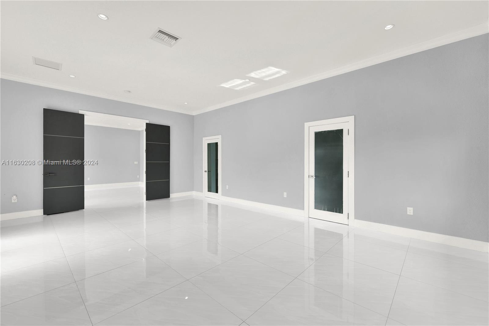 11921 Southwest 82nd Road Miami, FL 33156 - Photo 26 of 32 an empty room with closet and windows