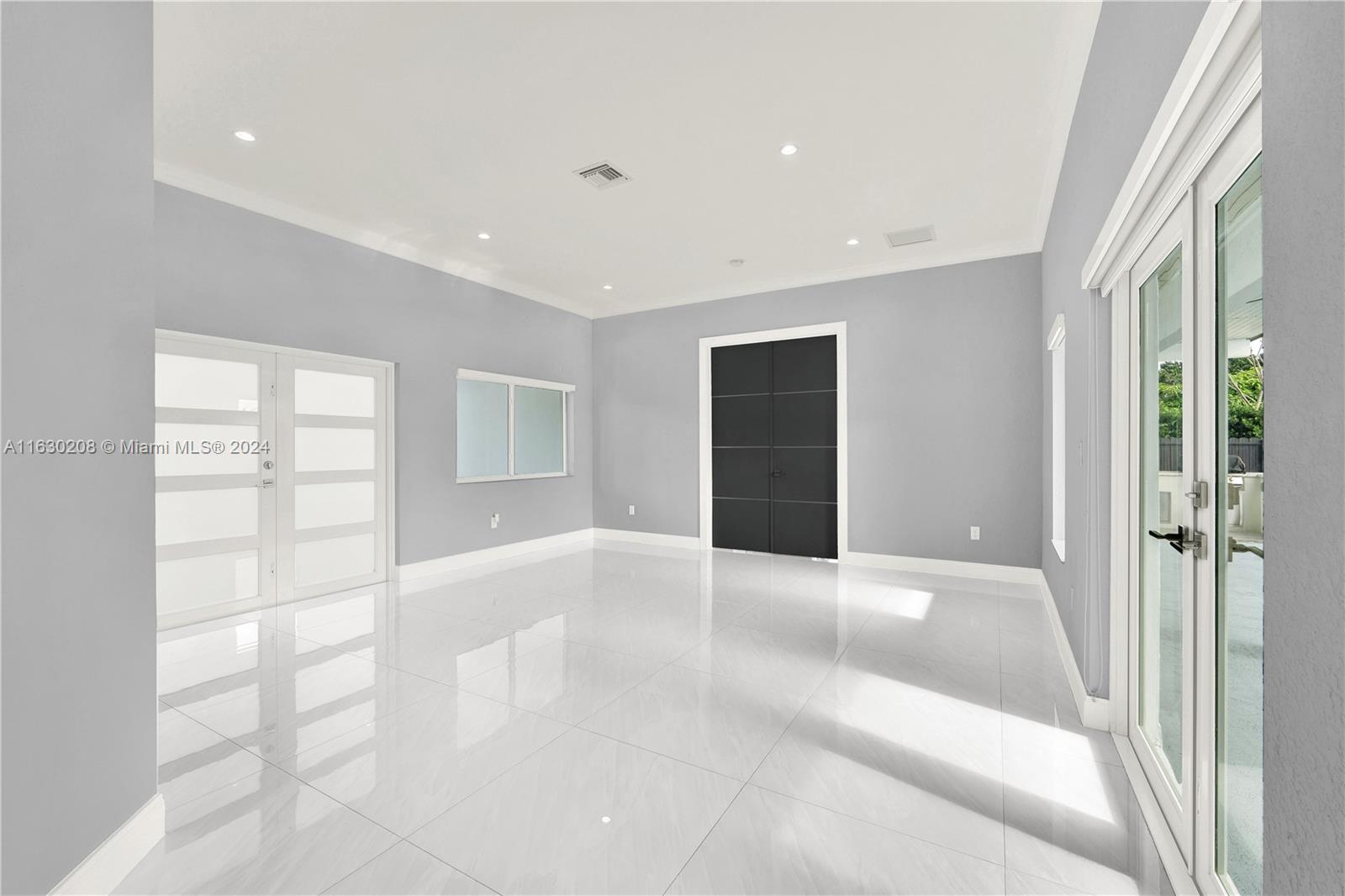 11921 Southwest 82nd Road Miami, FL 33156 - Photo 3 of 32 a view of an empty room with a window