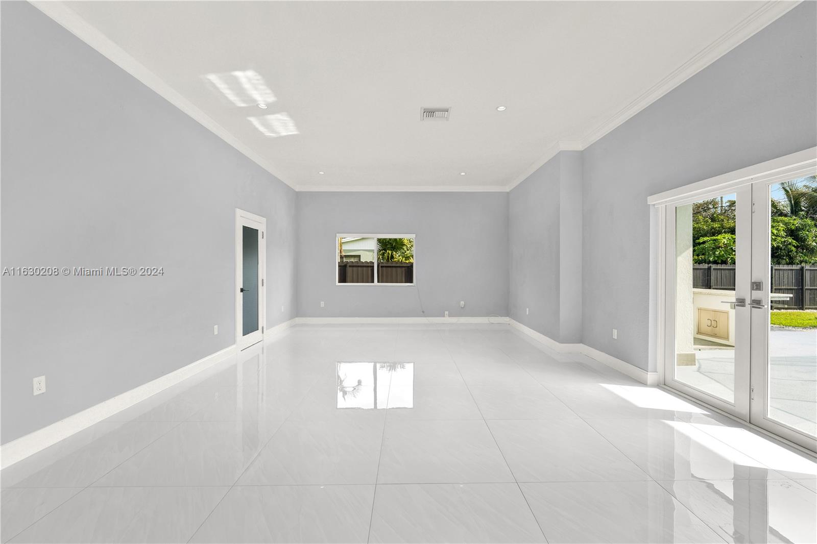 11921 Southwest 82nd Road Miami, FL 33156 - Photo 9 of 32 a view of an empty room and window