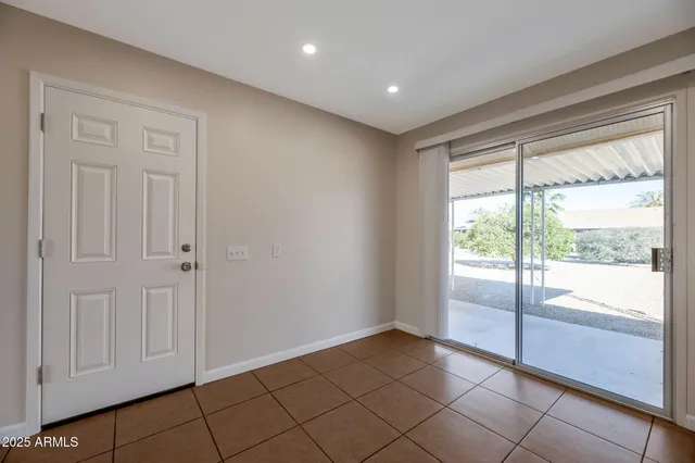 a view of an empty room and window