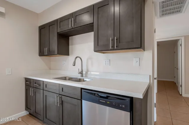 a kitchen with a sink and cabinets